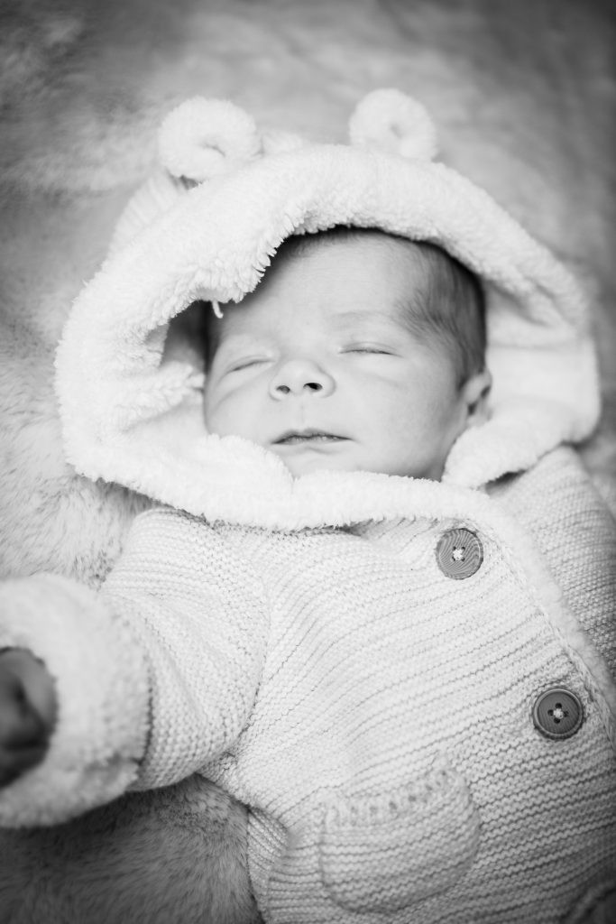 A posed shot of a newborn baby sleeping