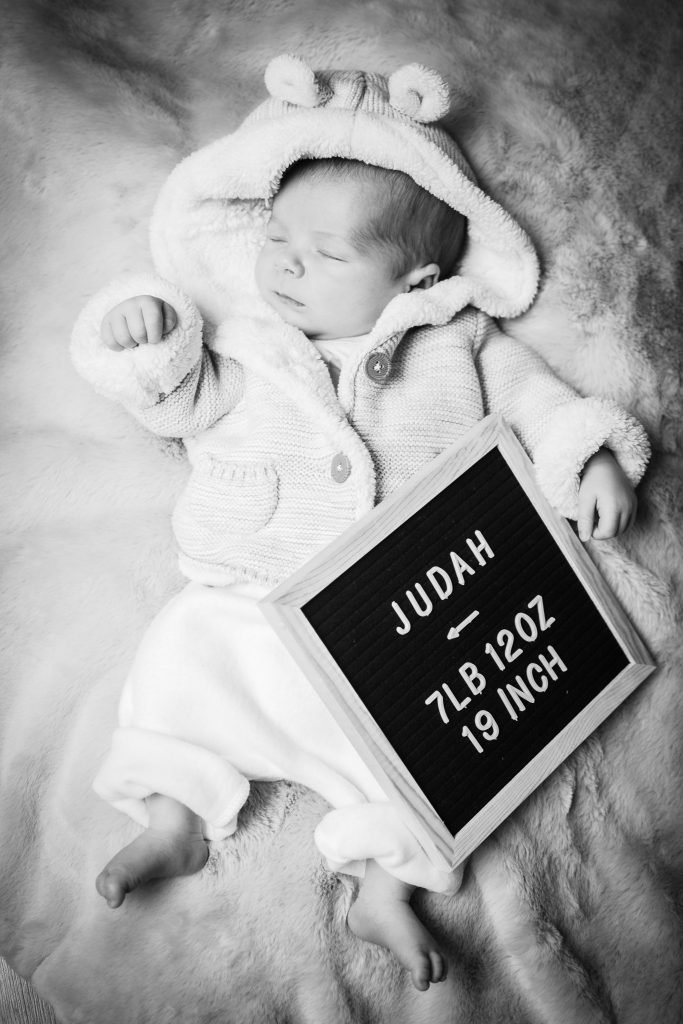 A posed shot of a newborn baby sleeping